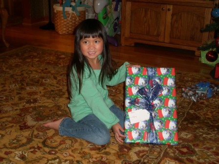 Kasen opening a few presents on Christmas Eve